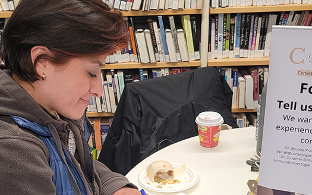 Student a table smiling