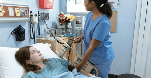 Health care worker and a patient Health care worker and a patient