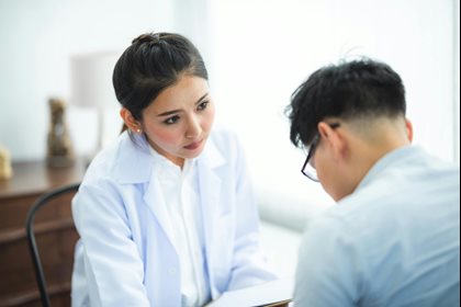 A doctor speaks with a patient