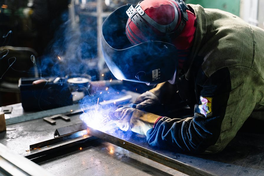 A welder using a torch