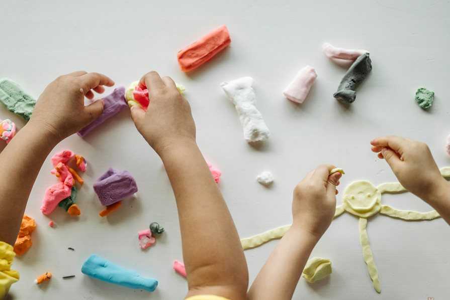 Children playing with play dough