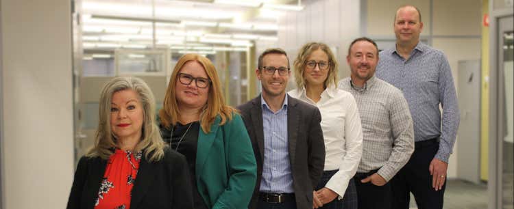 eHealth's Executive Leadership Team standing in a row.