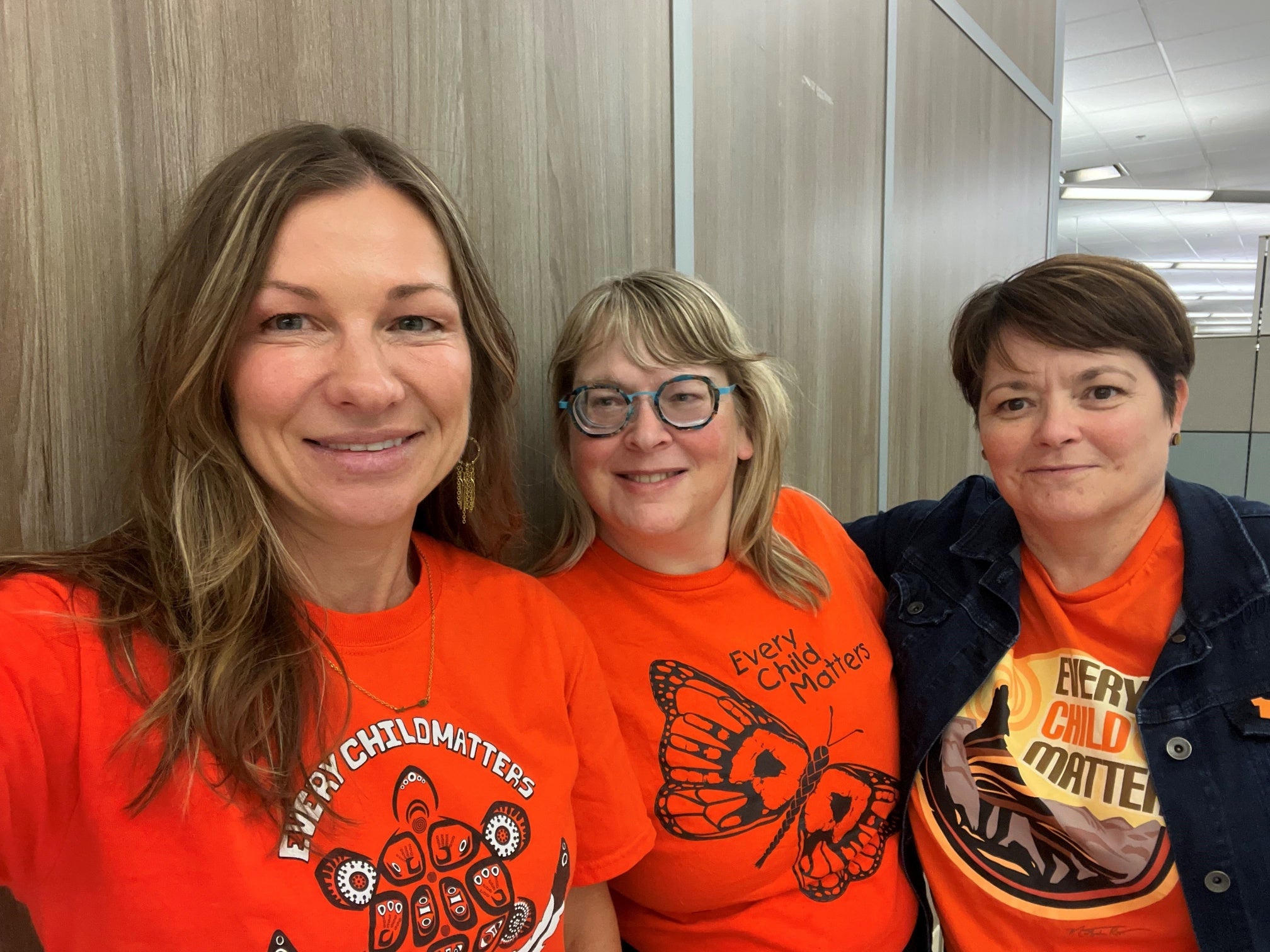 eHealth employees wearing orange shirts