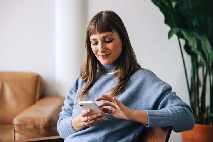 A woman using her smartphone.