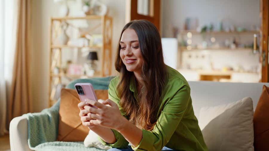 Woman looking at her cell phone.